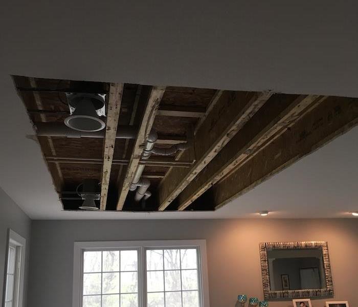 Ceiling with damaged areas cut away 