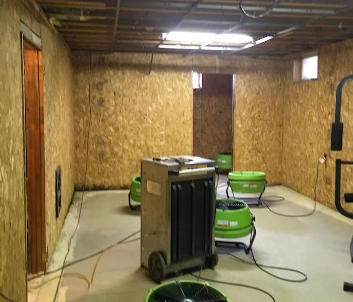  Basement with SERVPRO drying equipment and exposed framework