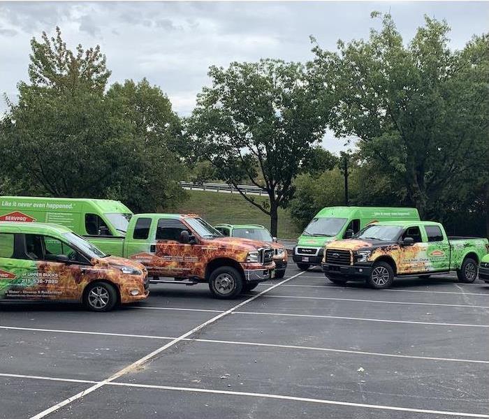 SERVPRO vans and trucks in a parking lot
